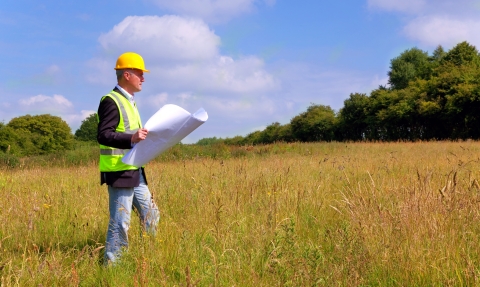 Planner looking at field